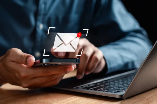 Businessman sending email by laptop computer to customer, business contact and communication, email icon, email marketing concept, send e-mail or newsletter, online working internet network.